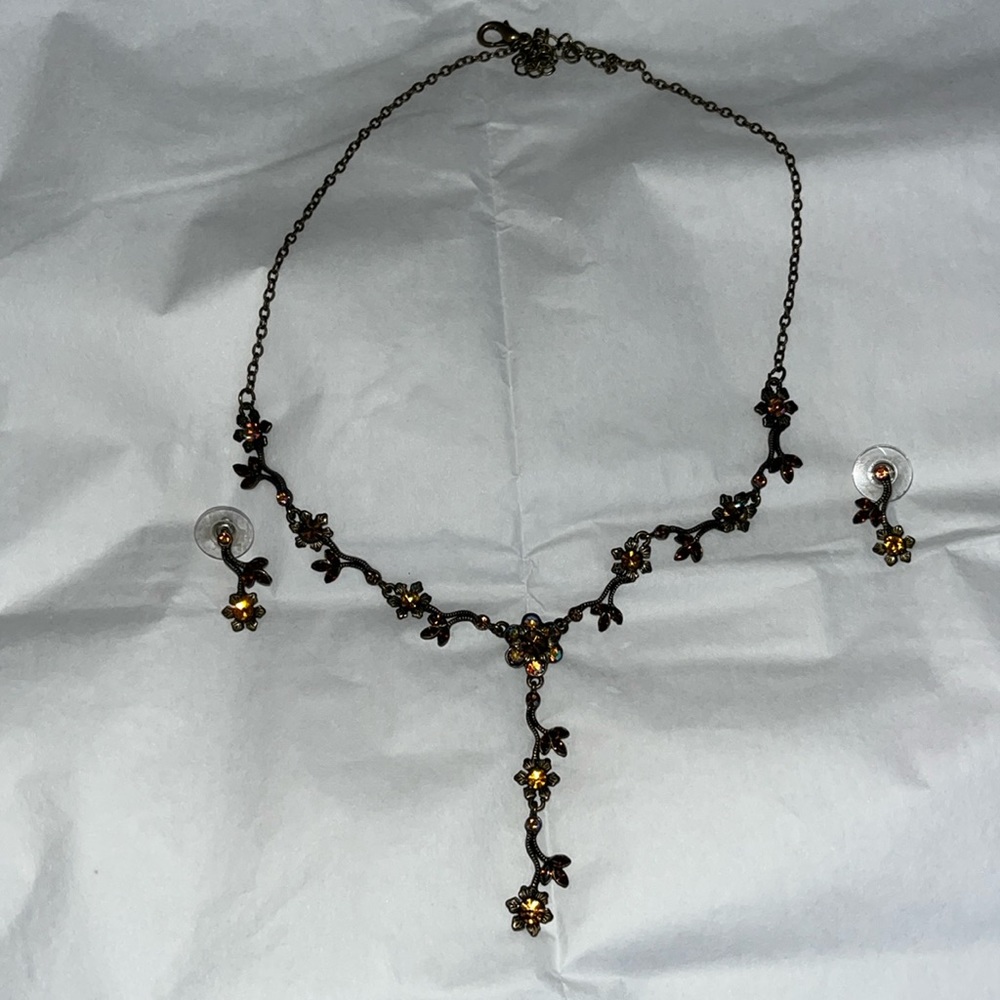 Black with topaz stones, earrings and 18” necklace.